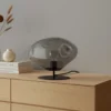Lámpara de mesa Lindby Lelia, gris humo, cristal, metal, Ø 35 cm