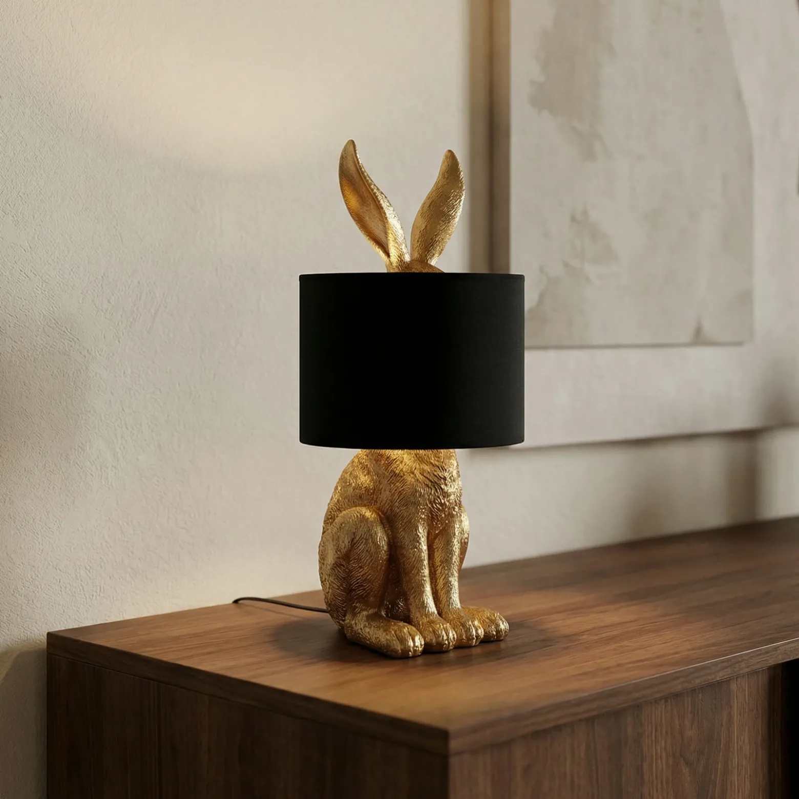 Lámpara de mesa Lindby Lorentina, altura 57 cm, conejo, dorada, textil