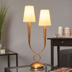 Lámpara de mesa Paola 2 luces dorada con pantallas textiles