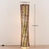 Lámpara de pie Lindby Joas, 110 cm, papel, textil, marrón