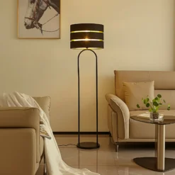 Lámpara de pie Lindby Tsomo, Ø 40 cm, negra, tela, E27