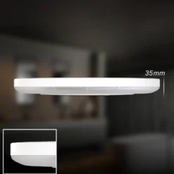 Lámpara de techo LED para baño Slim Drip, blanca, Ø 29 cm, IP44