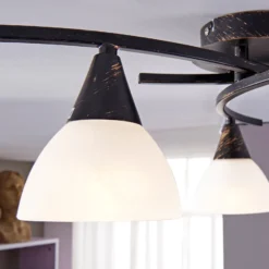 Lámpara de techo Lindby Della, negro-oro, Ø 58 cm, 3 luces, E14