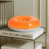 Lámpara LED de mesa/pared Fjora de Lindby, naranja/cromo, Ø30 cm, atenuable.