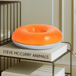 Lámpara LED de mesa/pared Fjora de Lindby, naranja/cromo, Ø30 cm, atenuable.