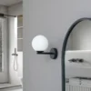 Lucande aplique de pared Bidolo, negro, cristal, Ø 12 cm, IP44