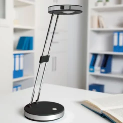 MAULpuck Lámpara de mesa LED, brazo telescópico, negro