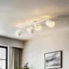 Plafón Lindby Aralena, blanco, 4 luces, longitud 97 cm