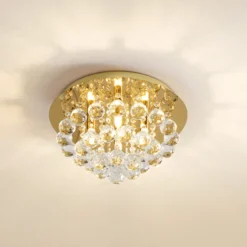 Plafón Lindby Gillion, 4 luces, dorada, cristal, Ø 35 cm
