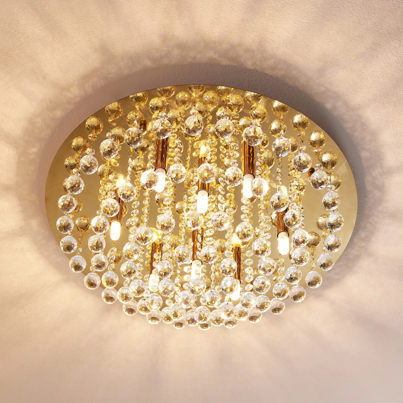 Plafón Lindby Gillion, 8 luces, dorado, cristal, Ø 55cm