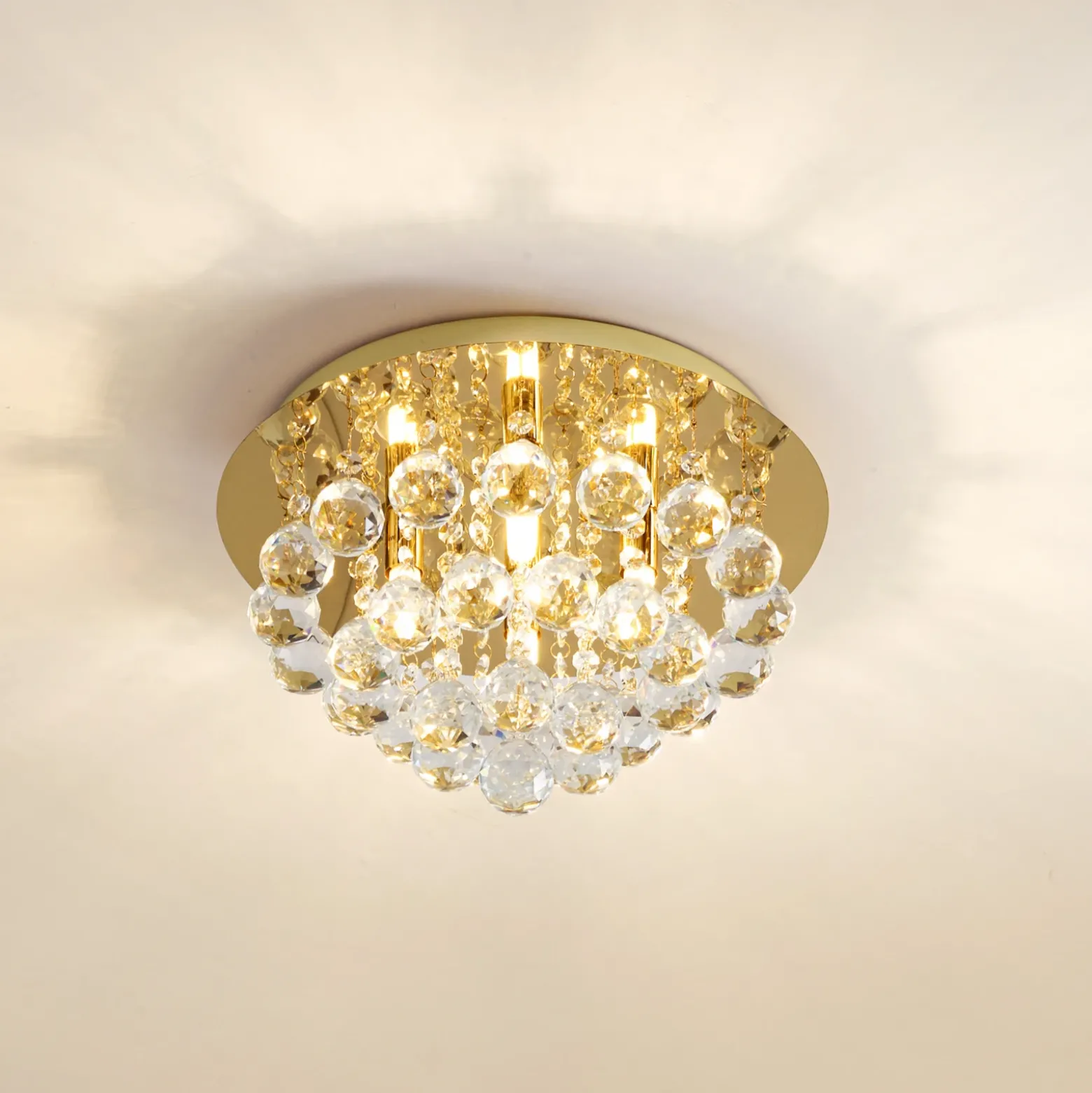 Plafón Lindby Gillion, 4 luces, dorada, cristal, Ø 35 cm