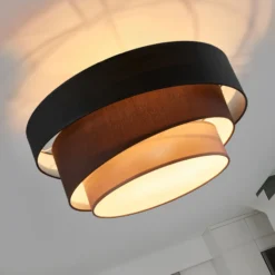 Plafón Lindby Melia, negro/marrón, tejido, Ø 56 cm