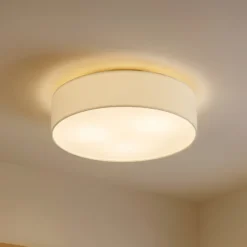 Plafón Lindby Sebatin, Ø 50 cm, blanco crema, tela, E27
