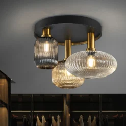 Plafón Norma, Ø 56 cm, 3 luces, negro/latón, cristal